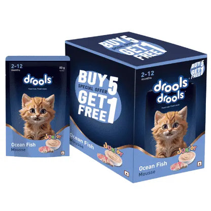 A box of Drools Ocean Fish Mousse cat food next to a single packet, featuring a ginger kitten on the packaging with a 'BUY 5 GET 1 FREE' offer graphic.